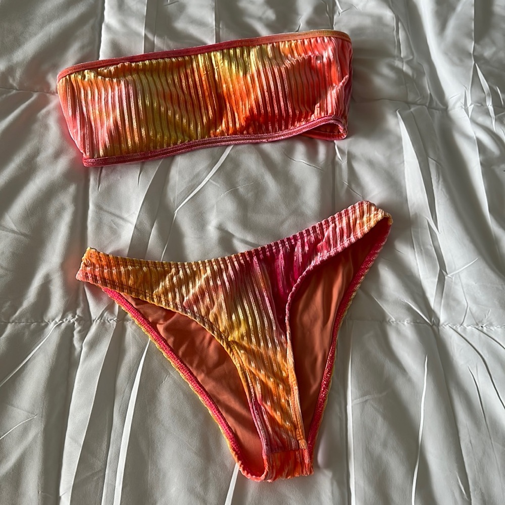 Dippin’ Daisy’s encore strapless bandeau in burn tie dye and nocturnal bottom